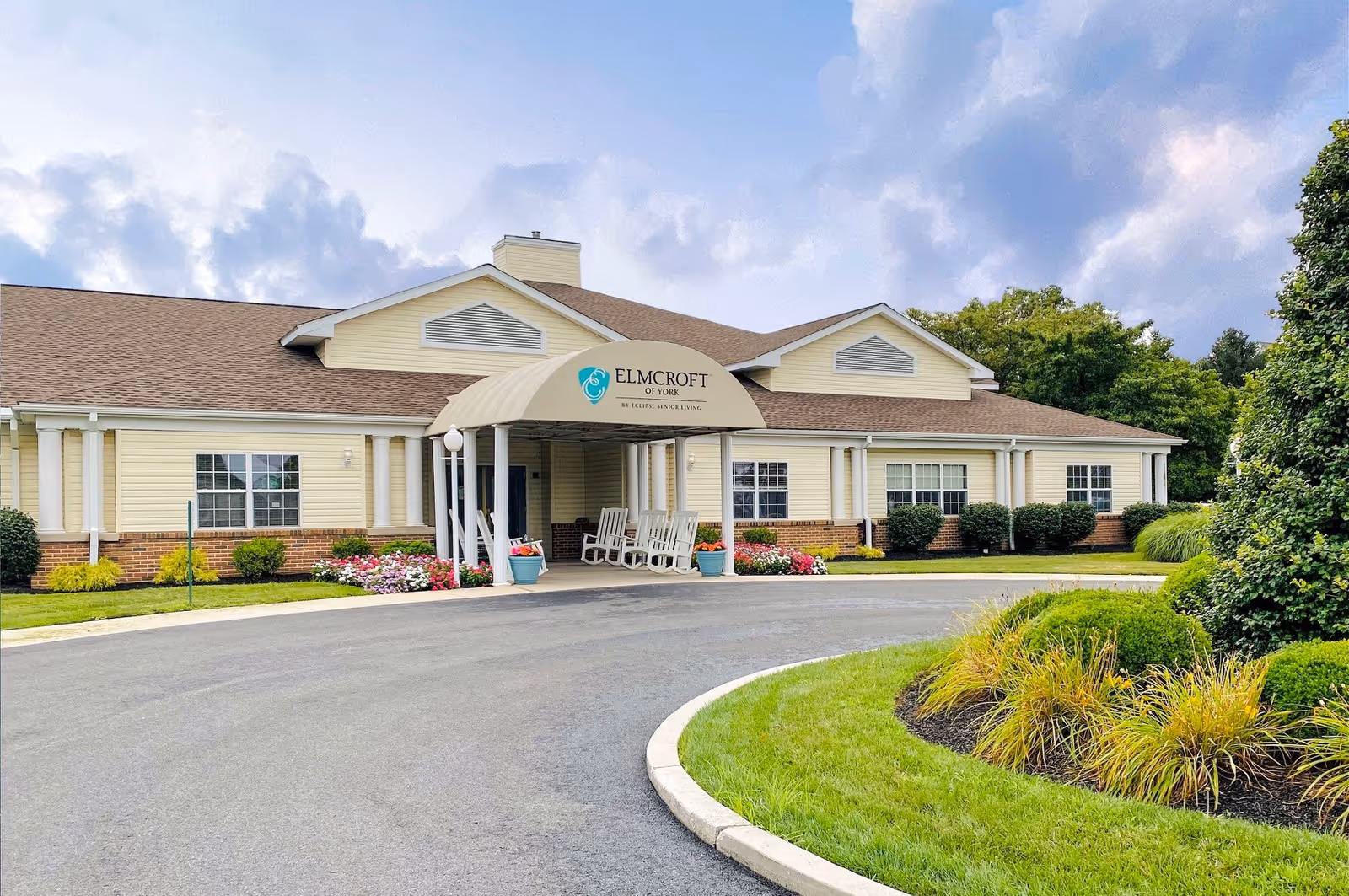 Single-story Celebration Villa of York senior living facility with a curved driveway and covered entrance.