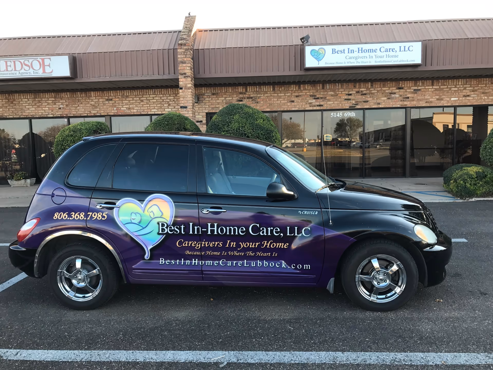 A branded Best In-Home Care van parked outside a brick storefront.