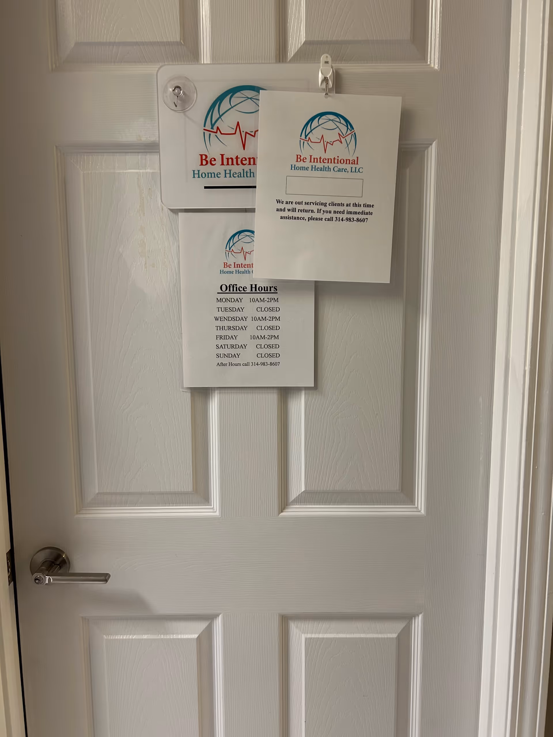 A white interior door with Be Intentional Home Health Care flyers posted.