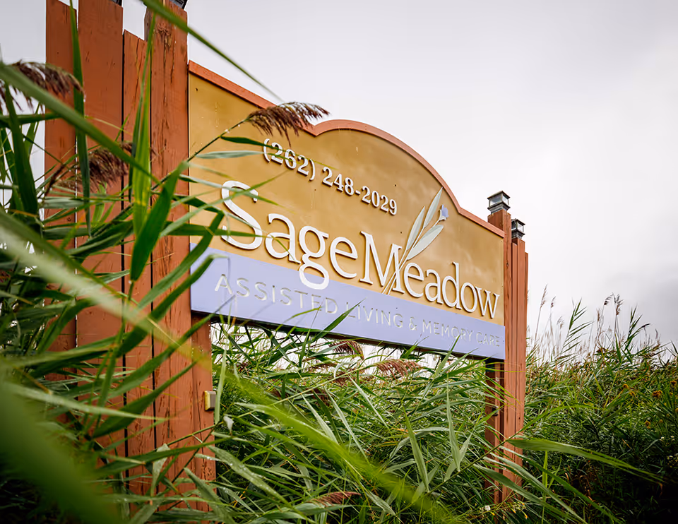 Sage Meadow Assisted Living sign with tall grasses in foreground.