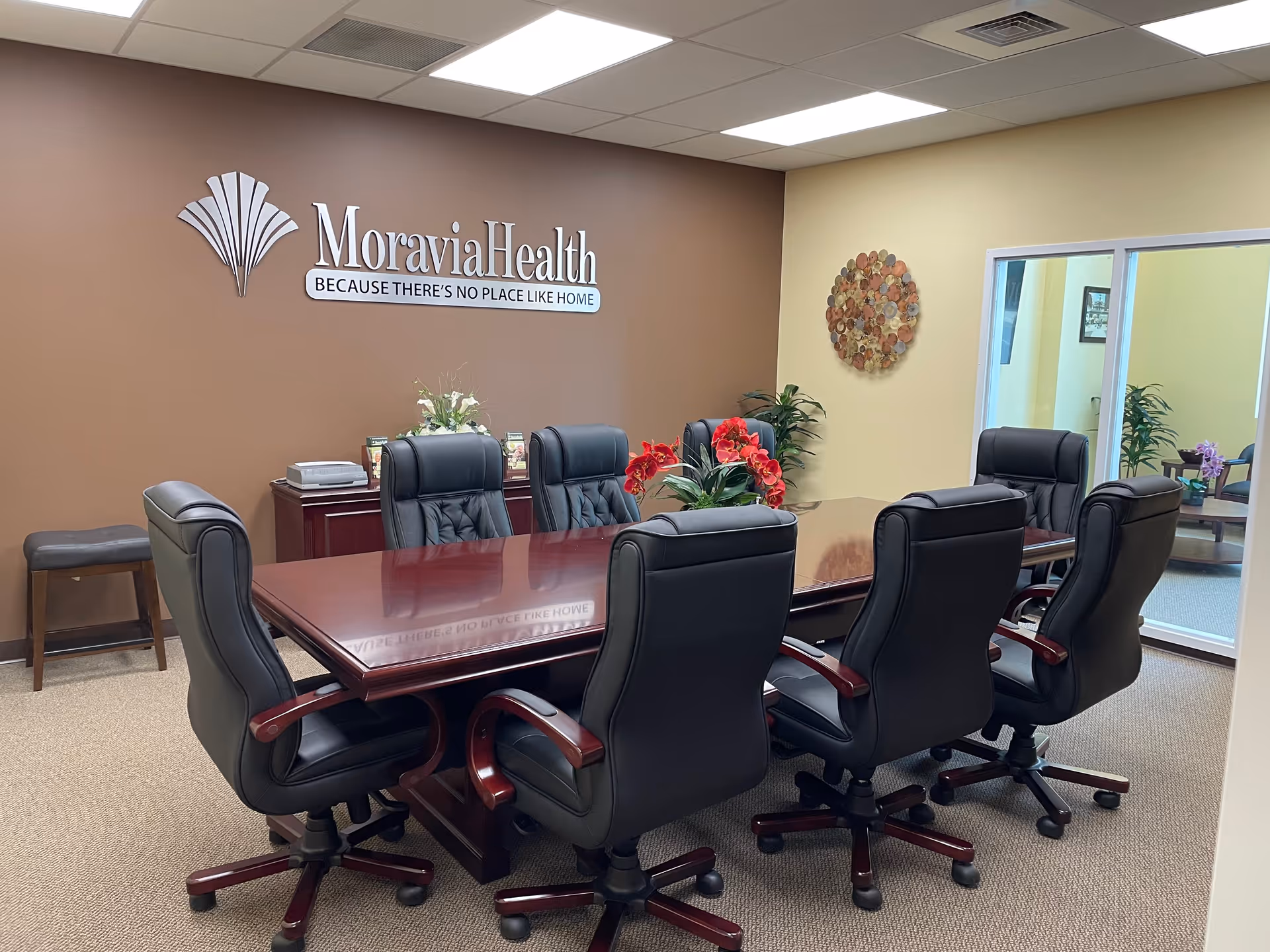 MoraviaHealth Scranton conference room with a large wooden table and black rolling chairs.