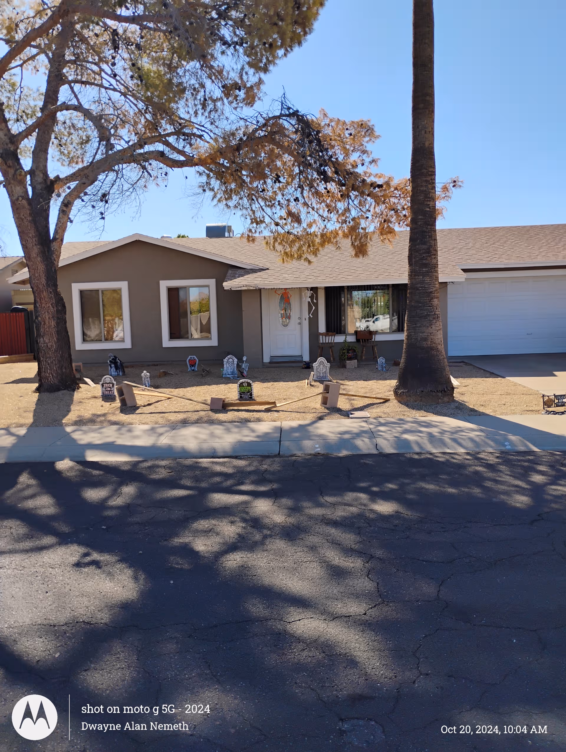 Front view of Golden Crown Assisted Living building with yard decorations.