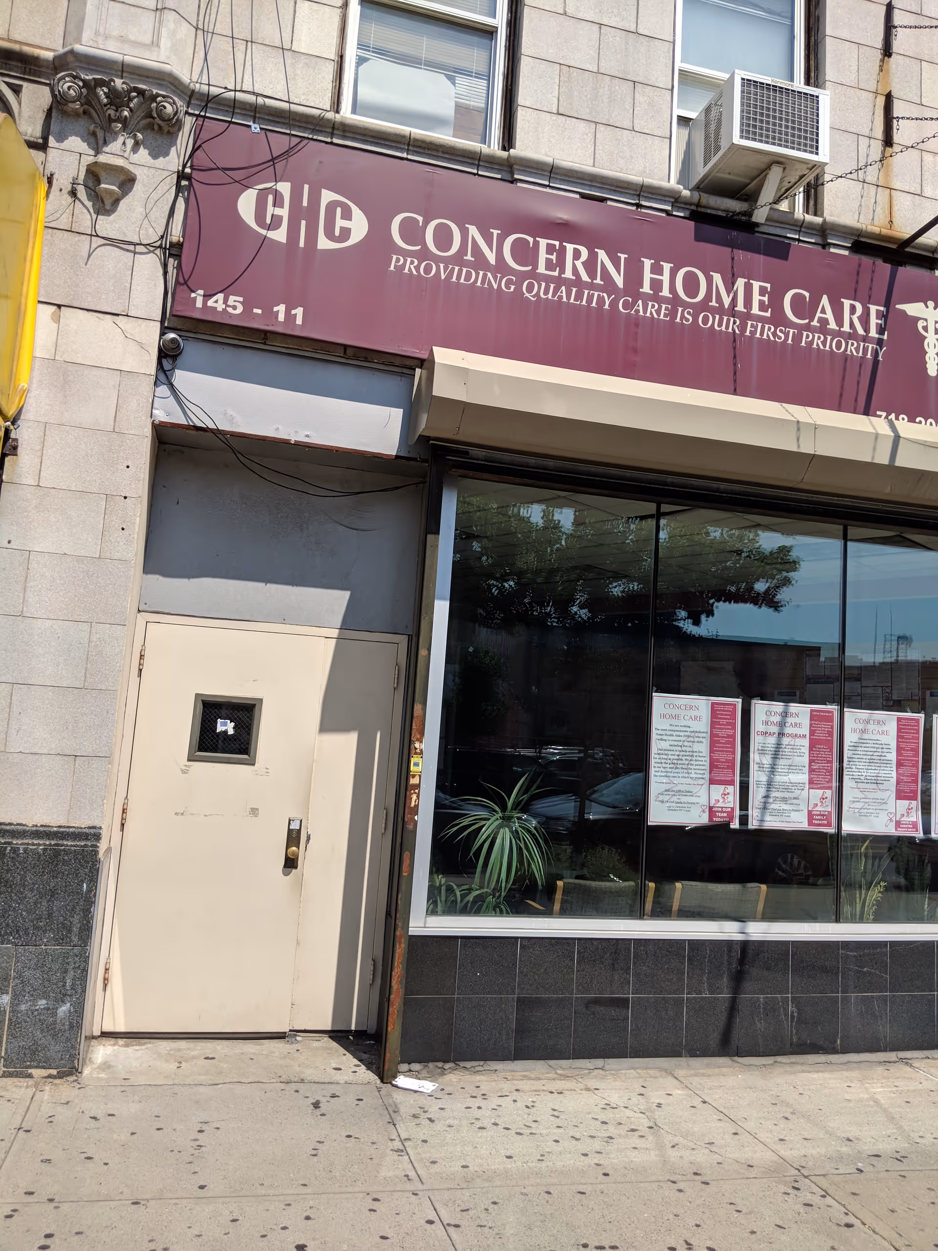 Storefront of Concern Home Care, Inc. with maroon sign above glass windows and door.