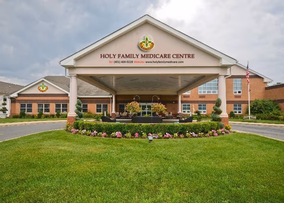 Front view of Holy Family Medicare Centre building with landscaped entry and awning.