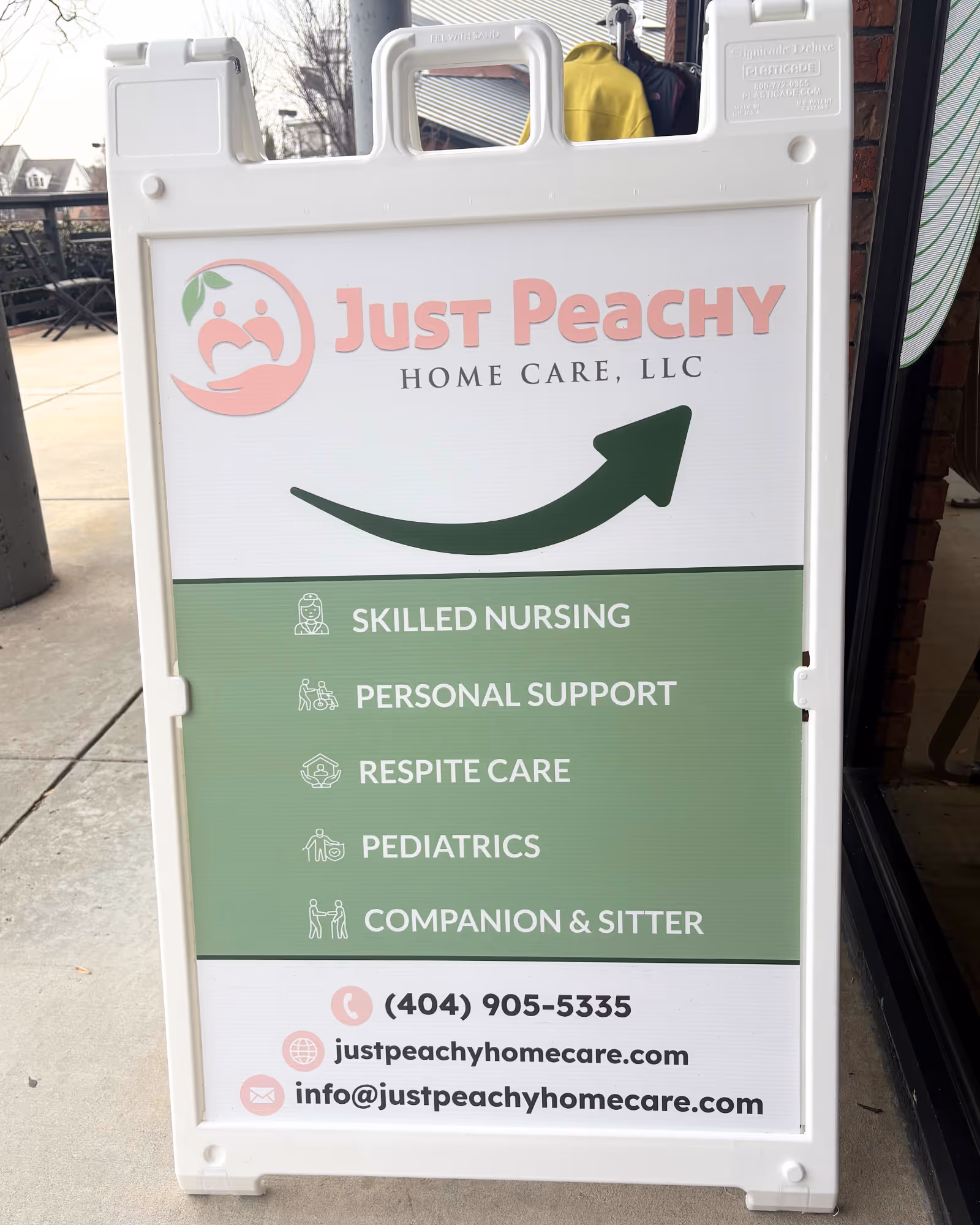 Outdoor sidewalk sign for Just Peachy Home Care listing services