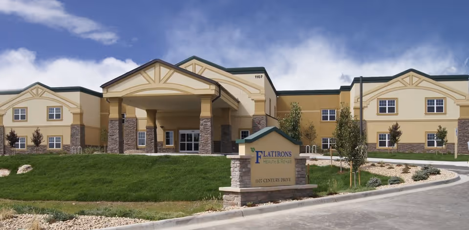 Flatirons Health and Rehab LLC facility exterior with a covered entrance and front sign.