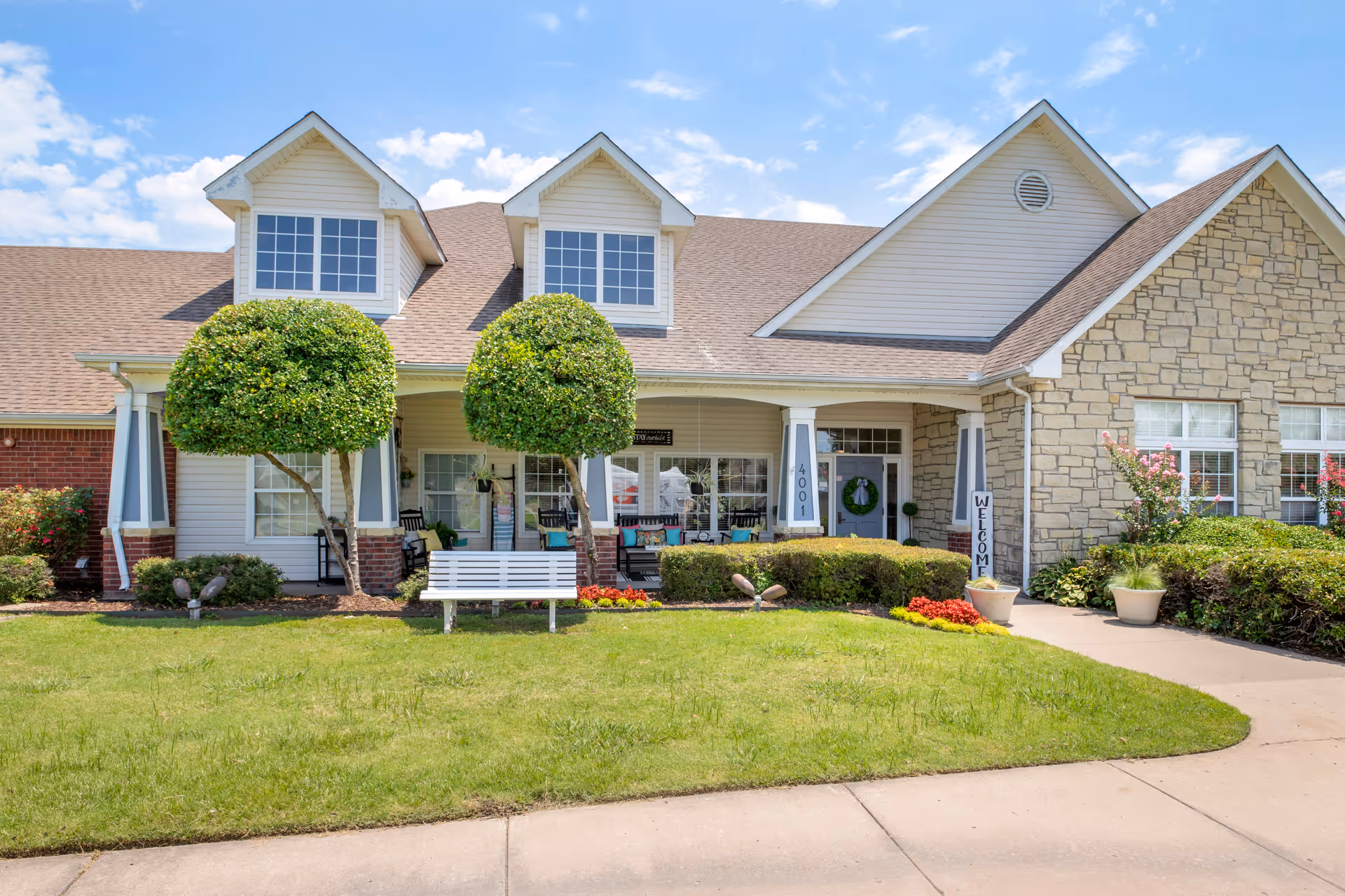 Front view of Brookdale Broken Arrow senior living facility with manicured lawn and welcoming entrance.