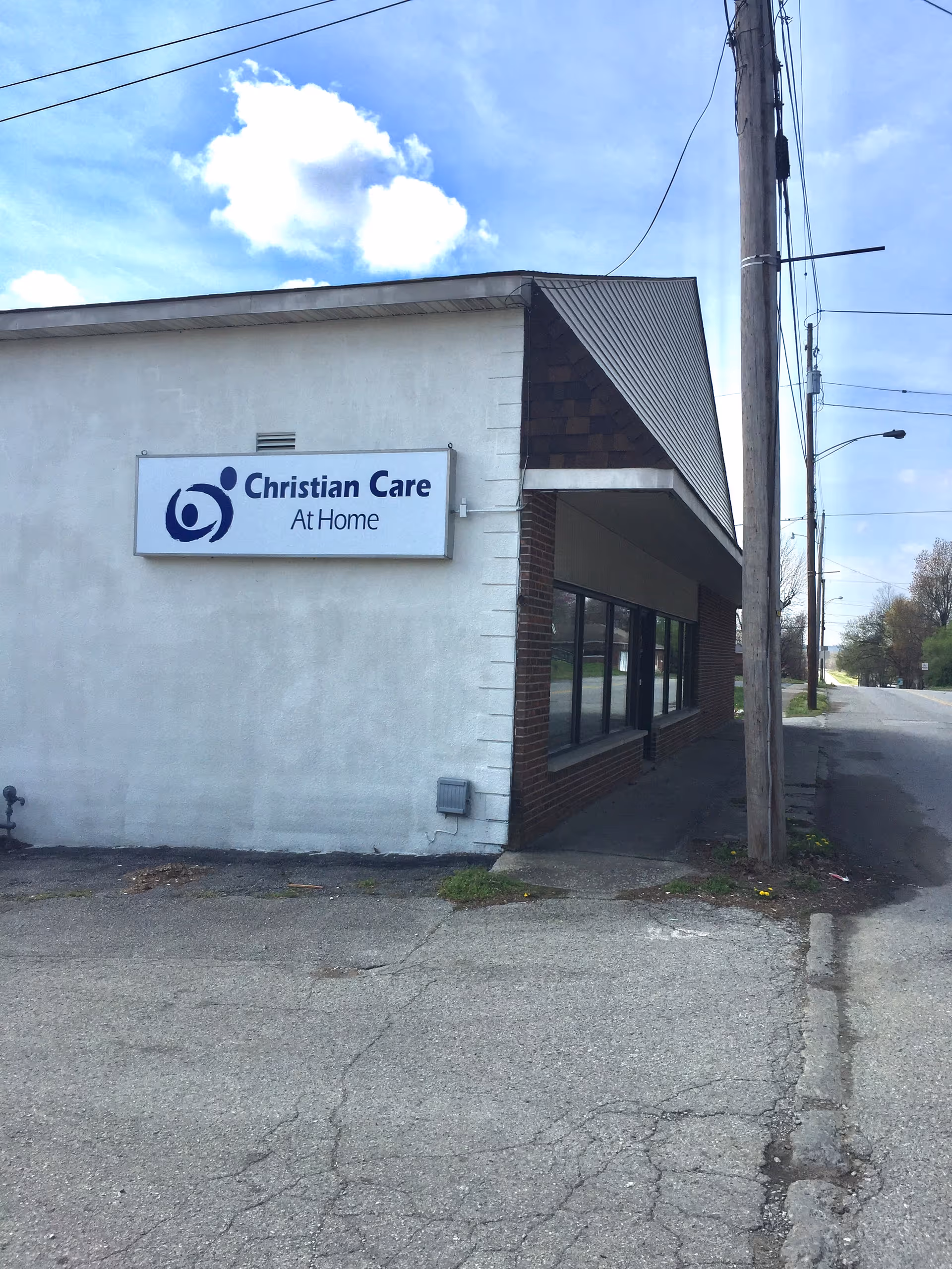 Exterior view of a small building with a Christian Care At Home sign