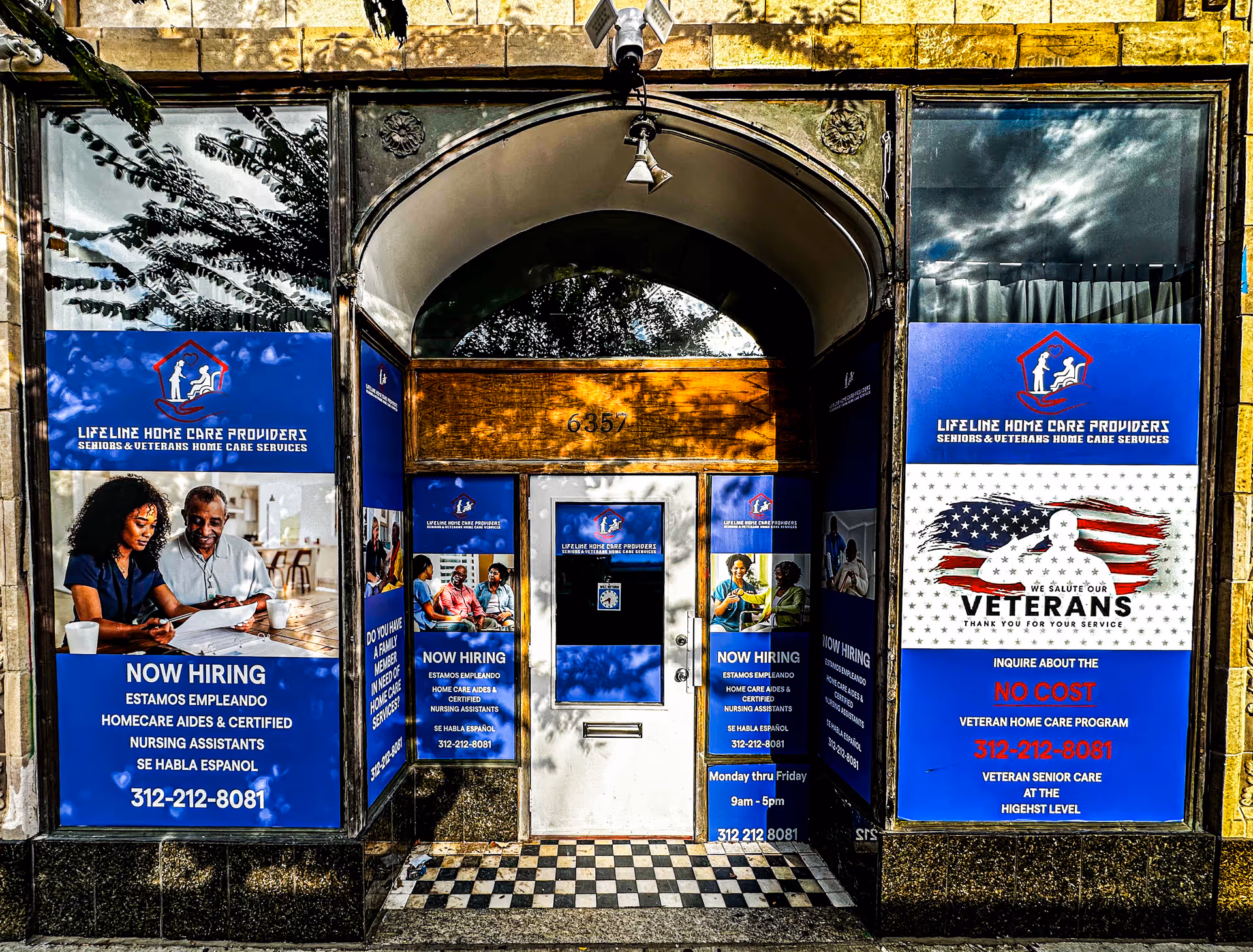 Entrance to Lifeline Home Care Providers storefront with large blue signs.