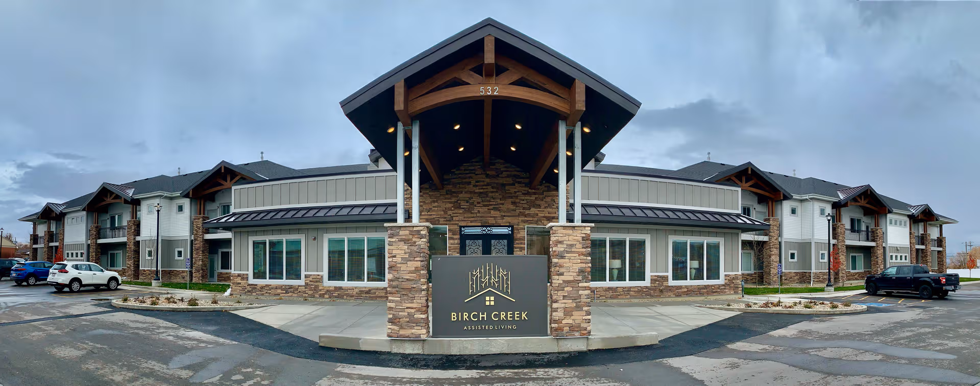 Front view of Birch Creek Assisted Living of Smithfield with stone entrance sign.
