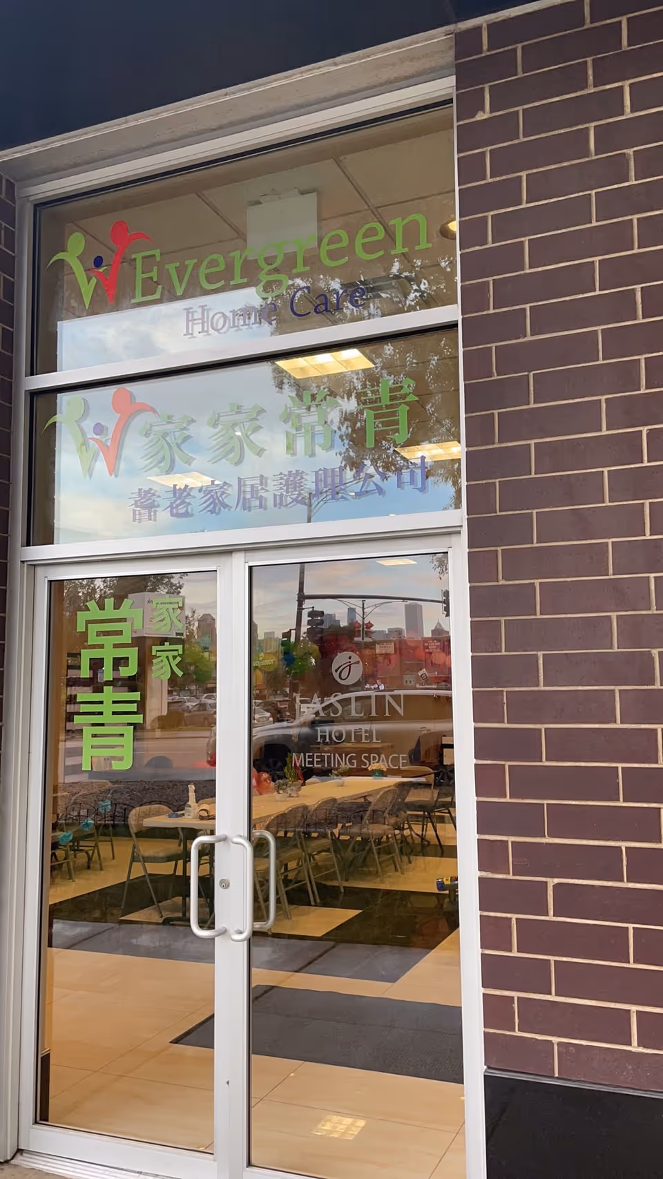 Glass storefront of Evergreen Home Care with interior dining area visible inside.