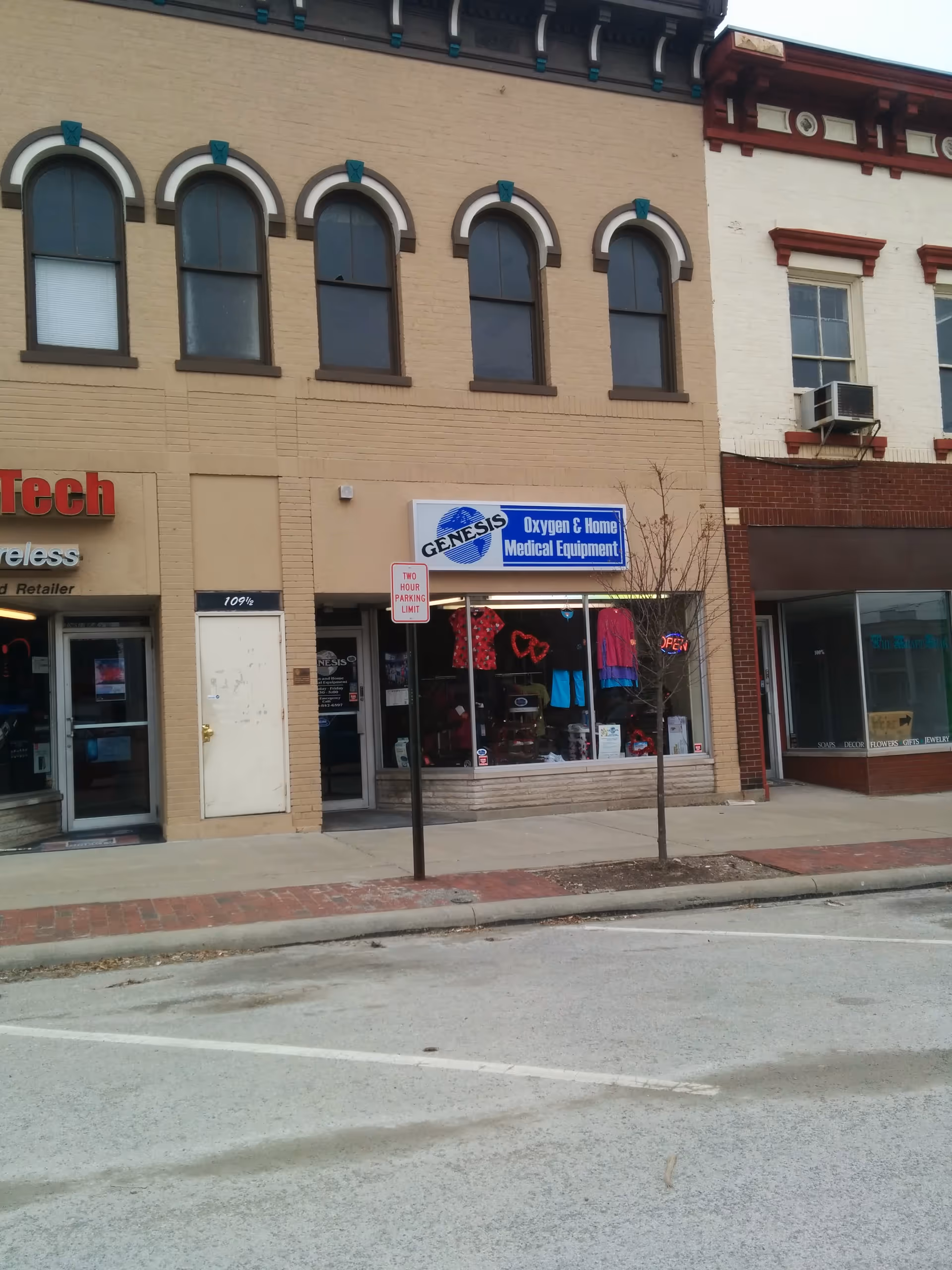 Exterior street view of Genesis Oxygen and Home Medical Equipment storefront on a downtown street