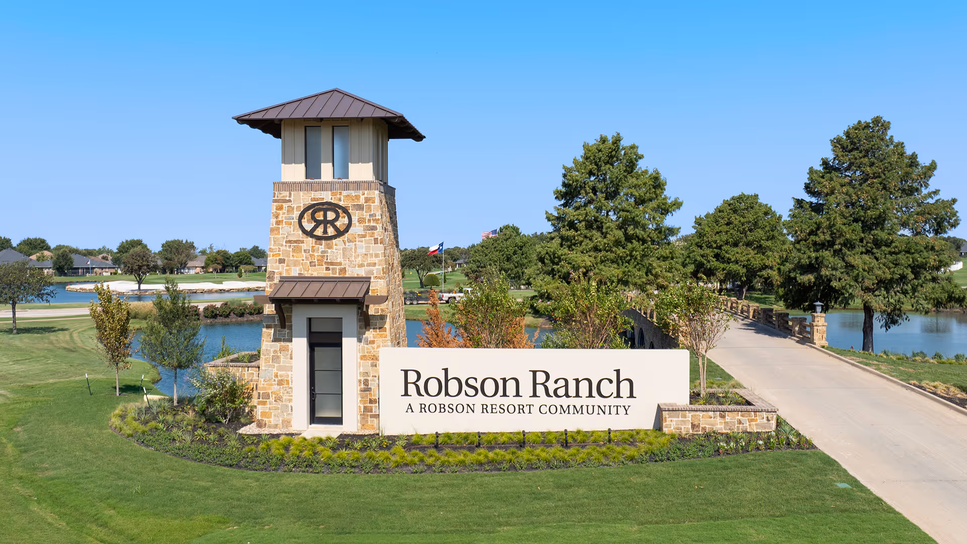 Stone entrance tower with Robson Ranch sign marks the community entrance.