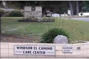 Exterior view of Windsor El Camino Care Center sign on a grassy, landscaped lot.