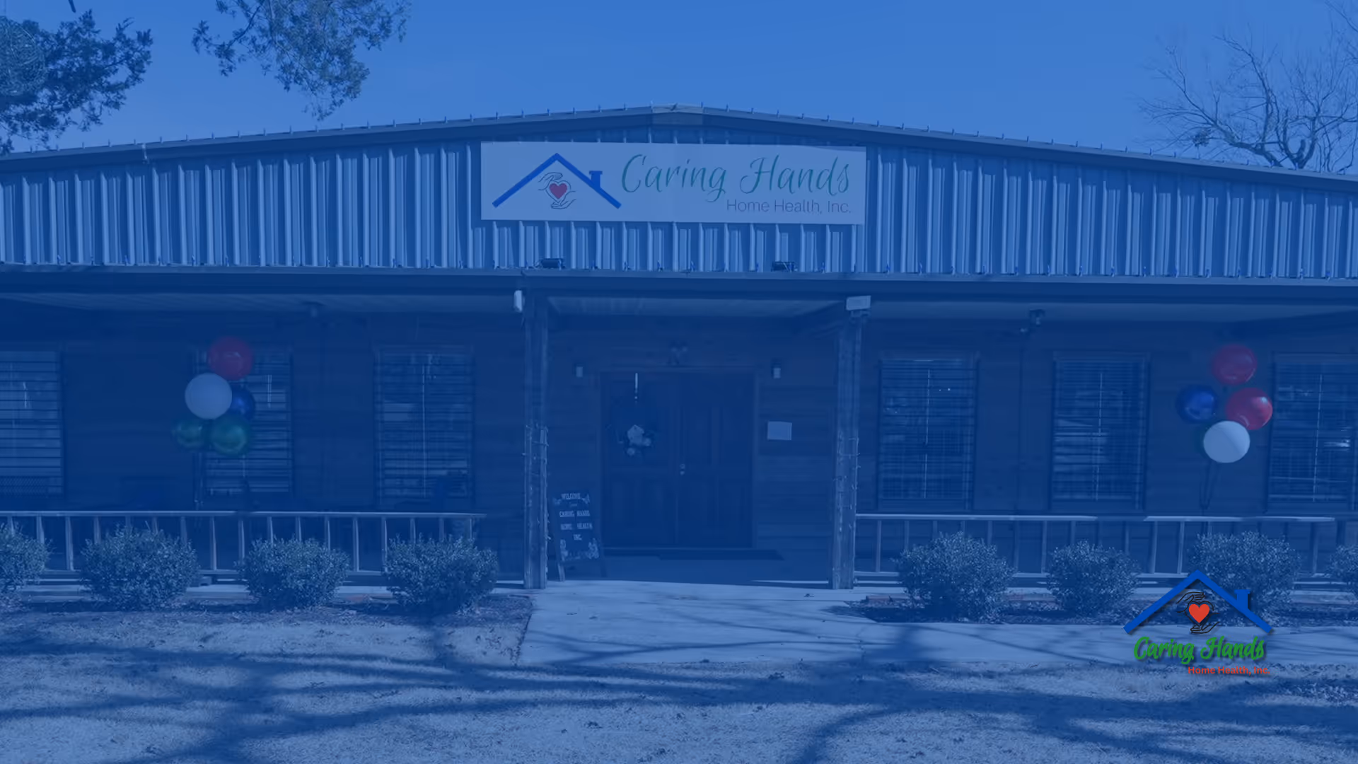 Front view of Caring Hands Home Health, Inc. facility with balloons.