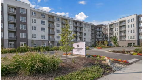 Front exterior of a multi-story MorningStar Senior Living building with landscaped grounds and a sign.