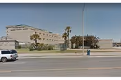 Exterior view of The Meridian senior living facility along the street.