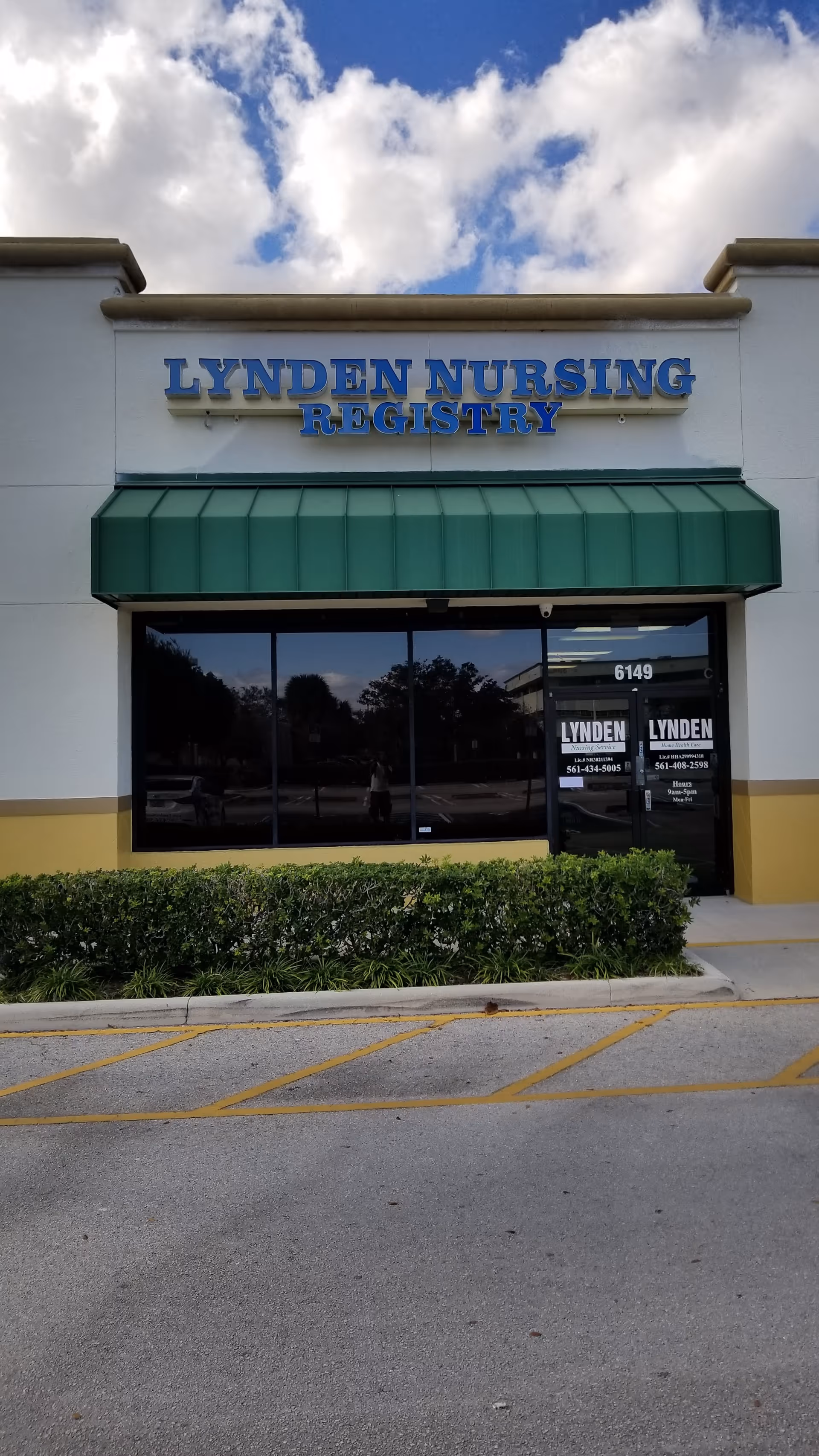 Front exterior of Lynden Nursing Registry with blue lettering and a green awning.
