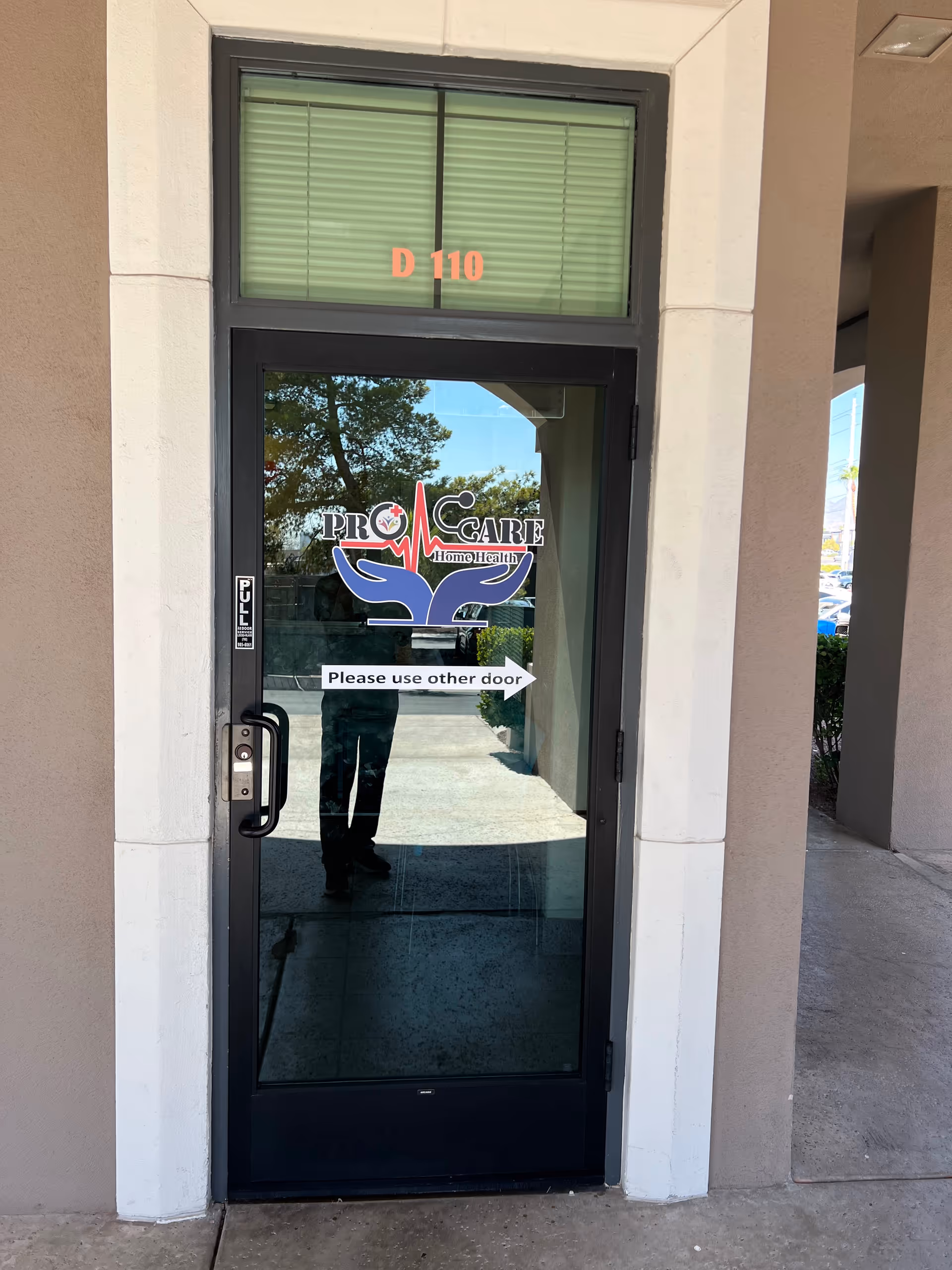 Exterior doorway with Procare Home Health logo and Please use other door sign.
