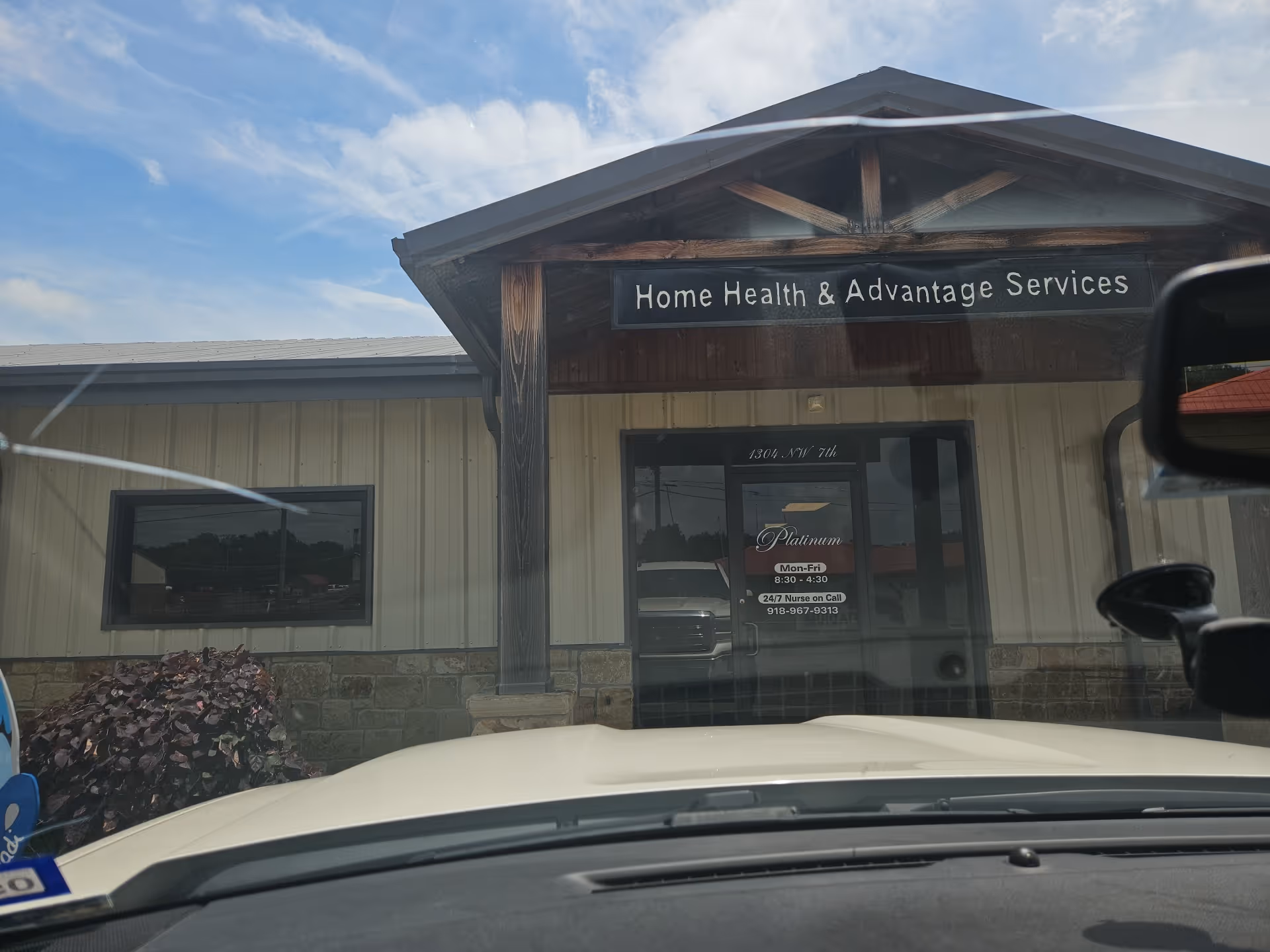 Exterior view of a building with a front porch sign reading Home Health & Advantage Services.