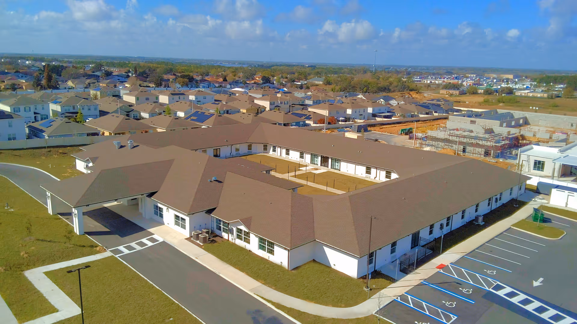 Aerial view of The Reserve at Davenport senior living campus with expansive parking.