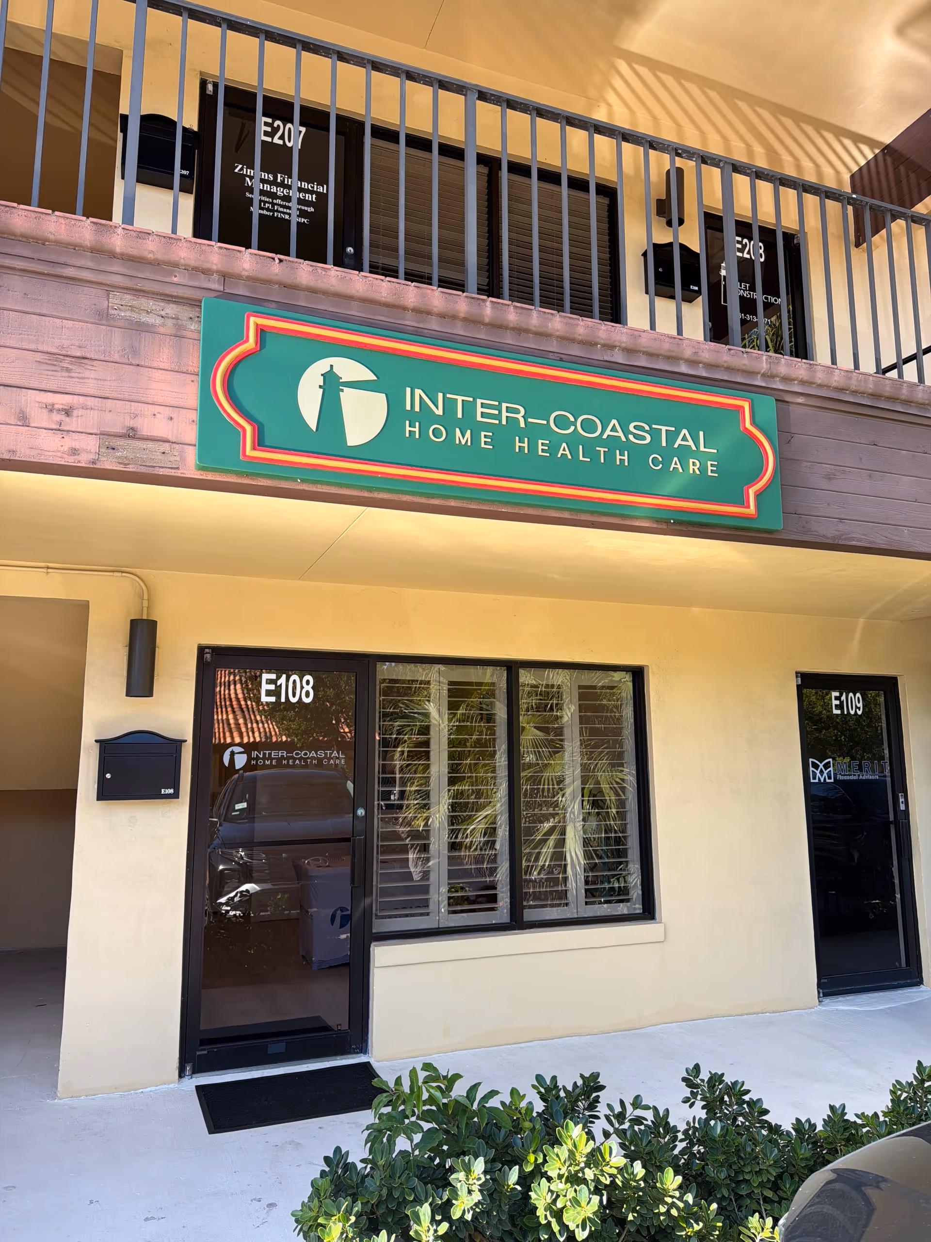 Exterior view of Inter-Coastal Home Health Care building entrance with sign and doors.