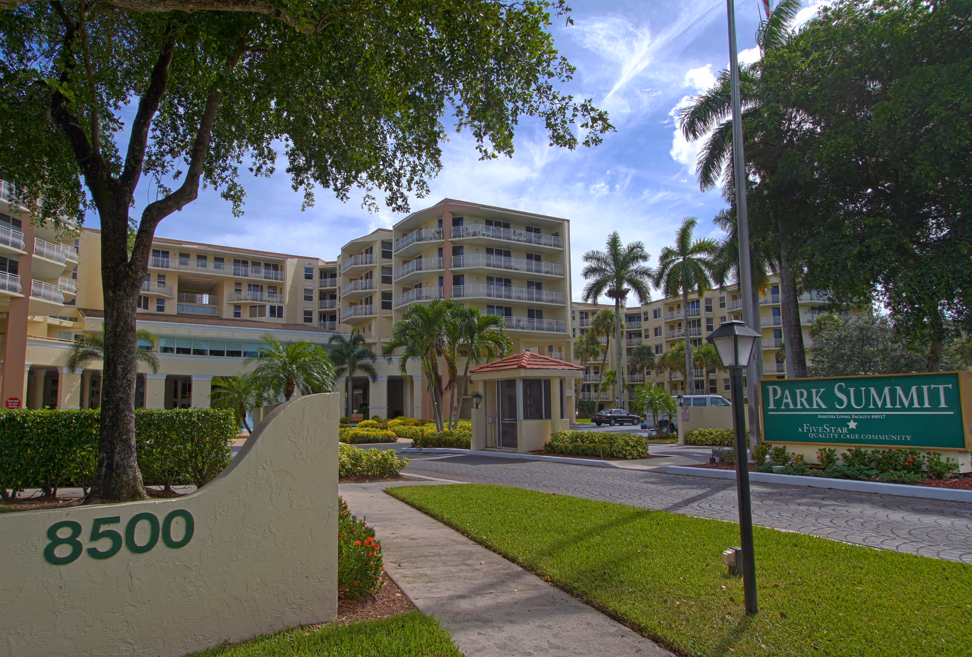 Exterior view of Park Summit senior living community with multi-story buildings and landscaping.