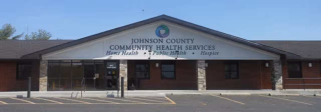 Single-story brick facility with Johnson County Community Health Services sign and entrance.