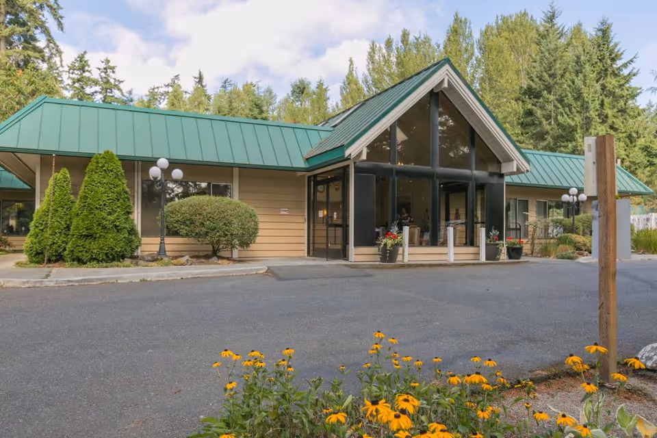 Bainbridge Island Health & Rehab Center exterior with glass entrance and landscaped surroundings