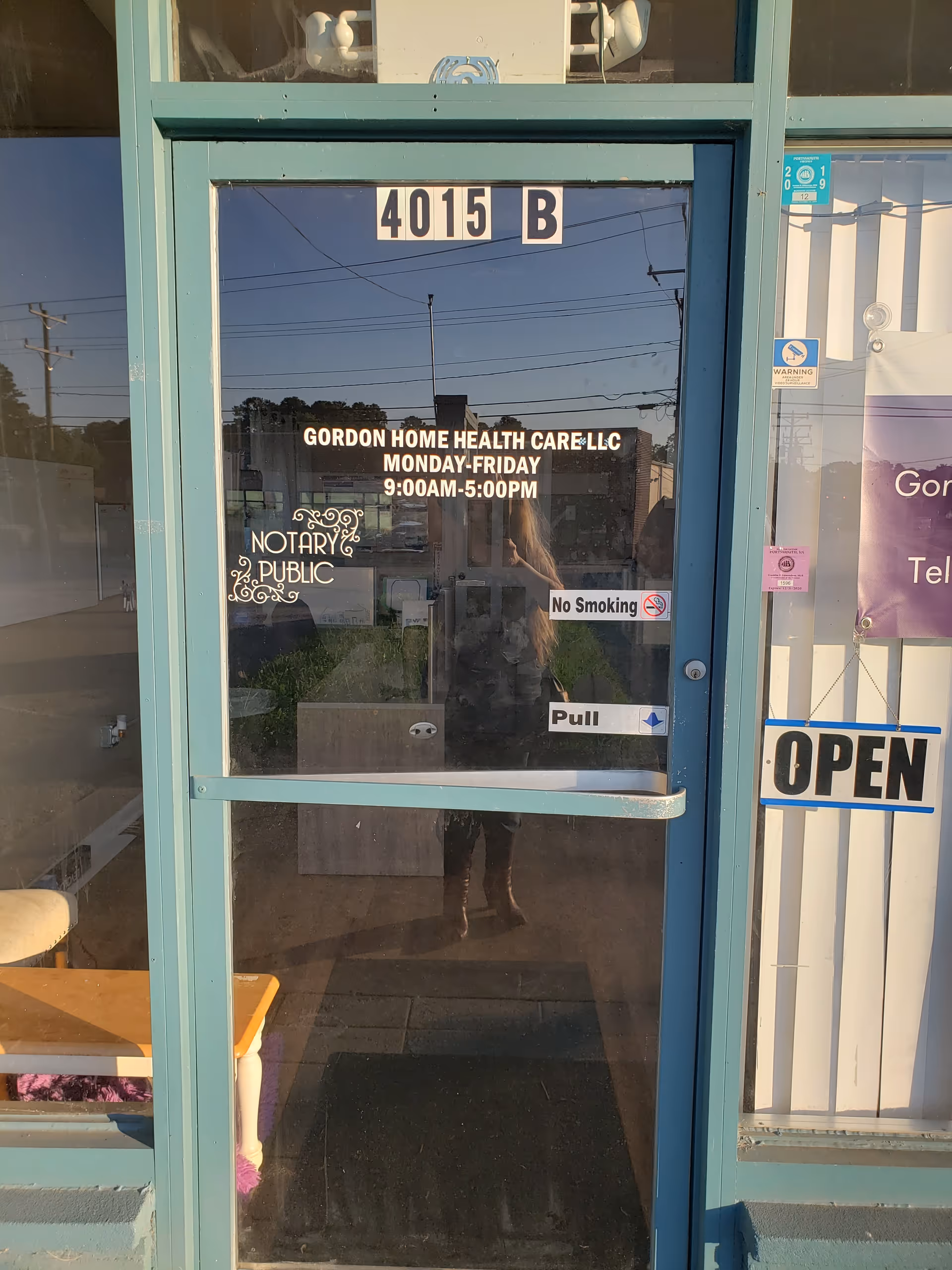 Glass entrance door for Gordon Home Health Care LLC with an Open sign
