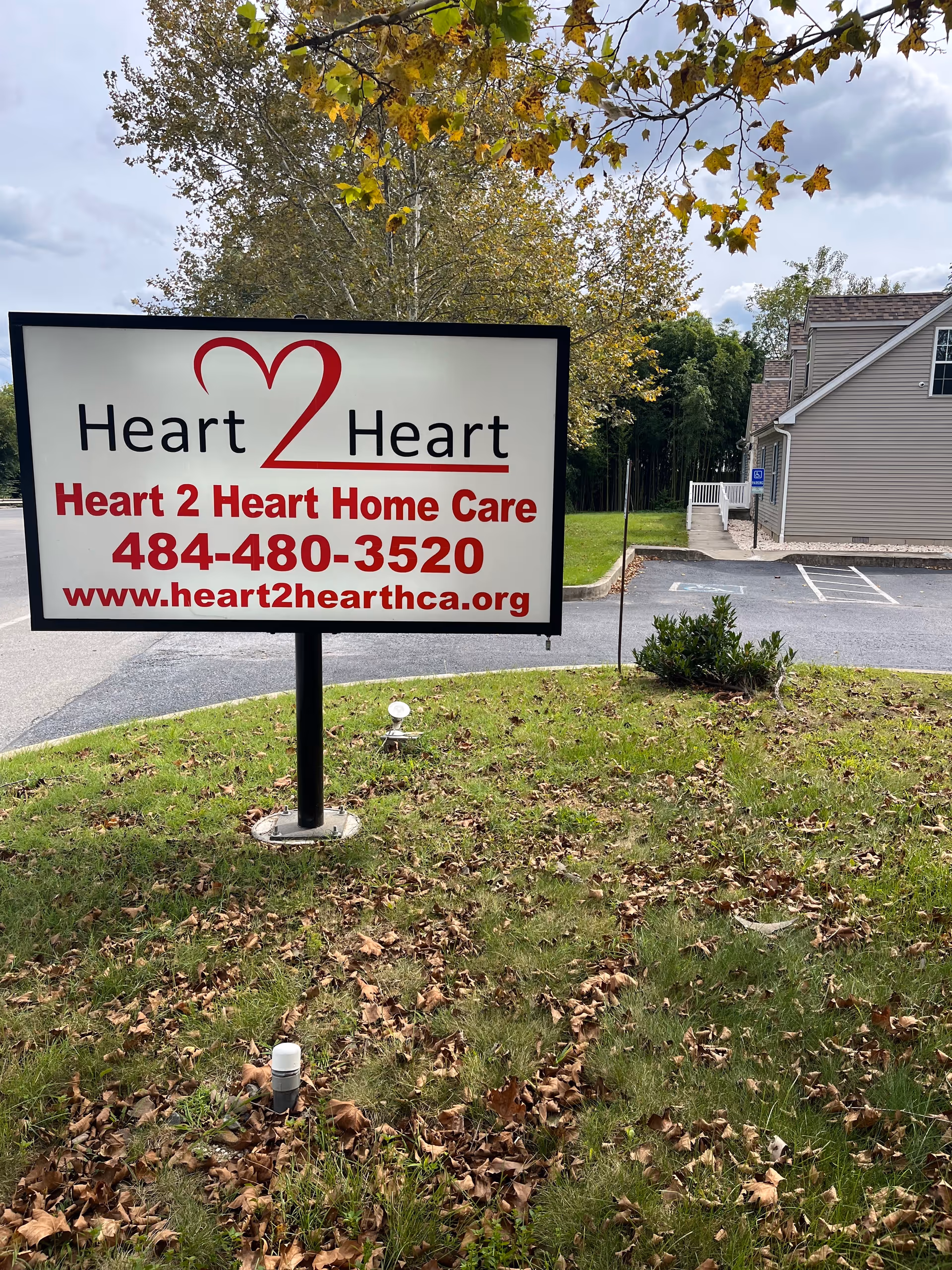 Outdoor Heart 2 Heart Home Care Agency sign in front of a building.