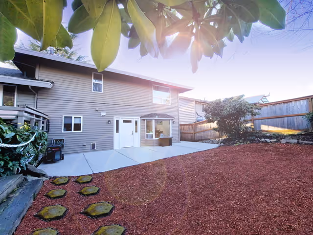 Exterior of Kindness Adult Family Home showing patio and yard.