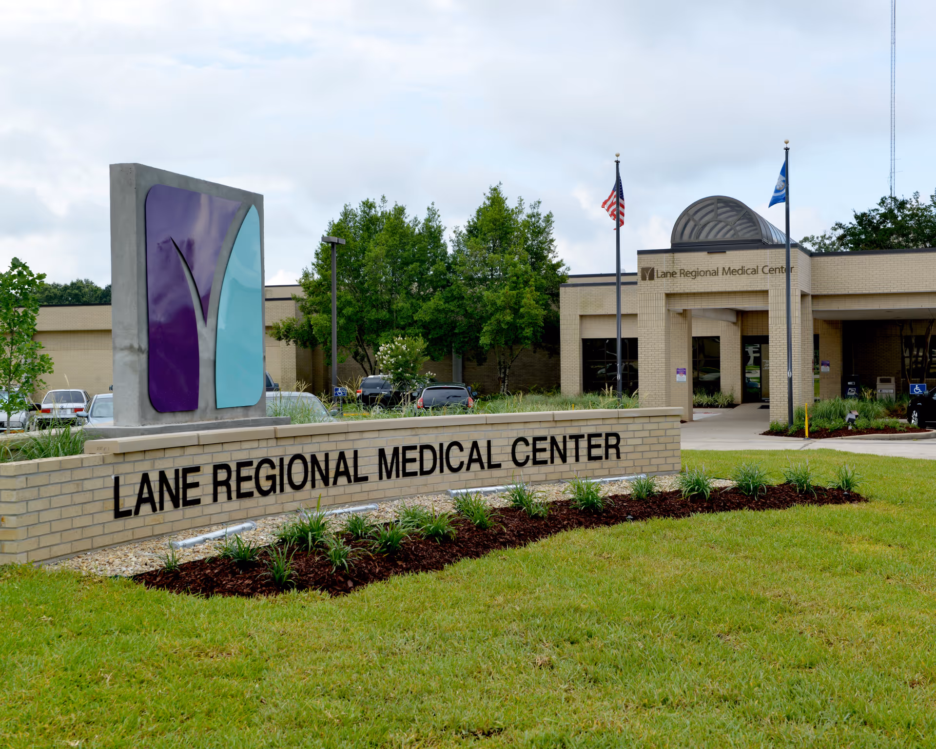 Exterior view of Lane Regional Medical Center with front sign and entrance.
