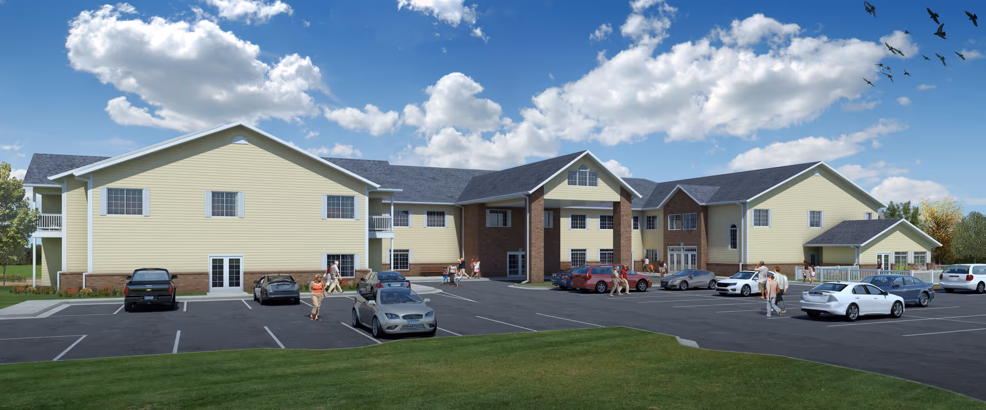 Exterior view of Oak Terrace Senior Living of Le Sueur, a multi-wing building with parking.