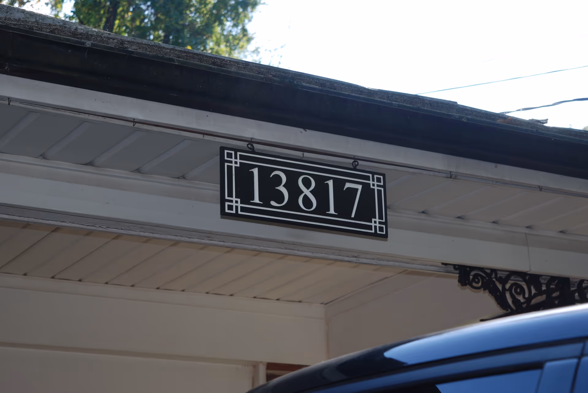 Front of building with address plaque reading 13817.