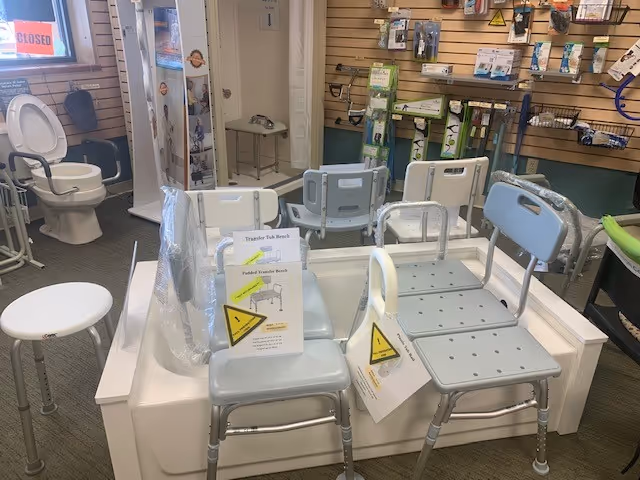 Showroom interior with bathroom chairs, mobility aids, and medical equipment displays.