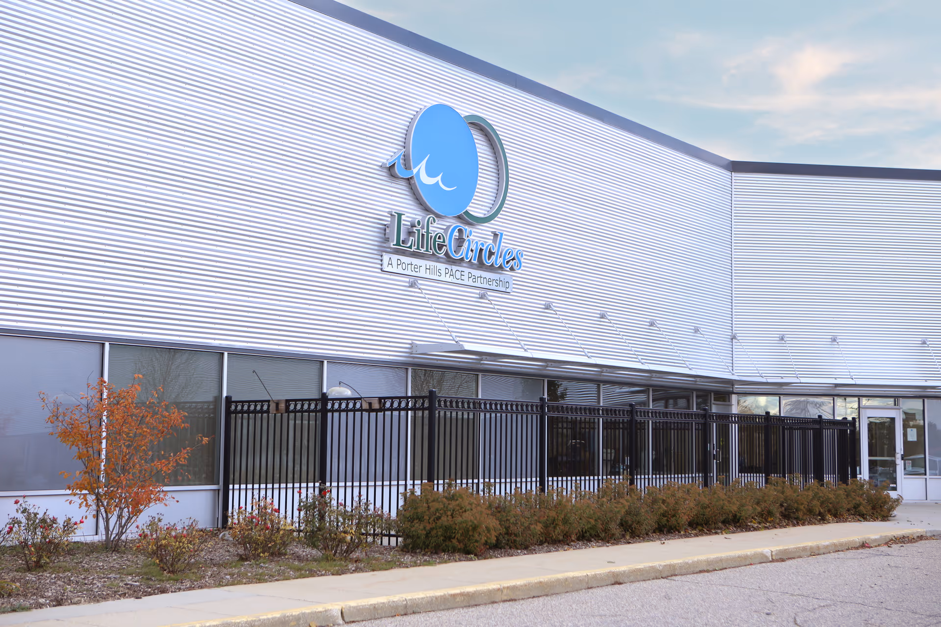 Exterior view of LifeCircles PACE building with signage and landscaping along the front.