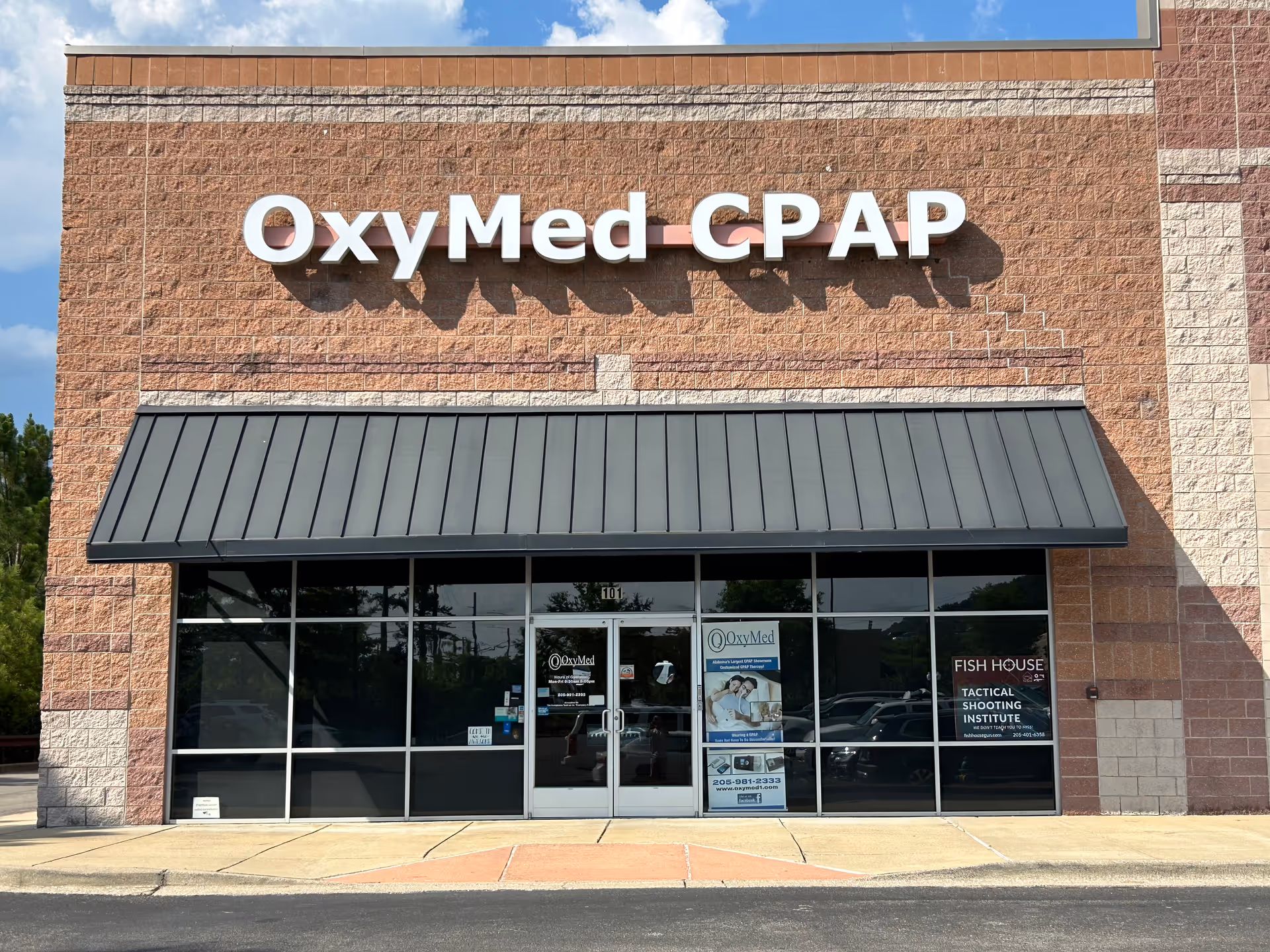 OxyMed CPAP storefront with glass doors and a metal awning.