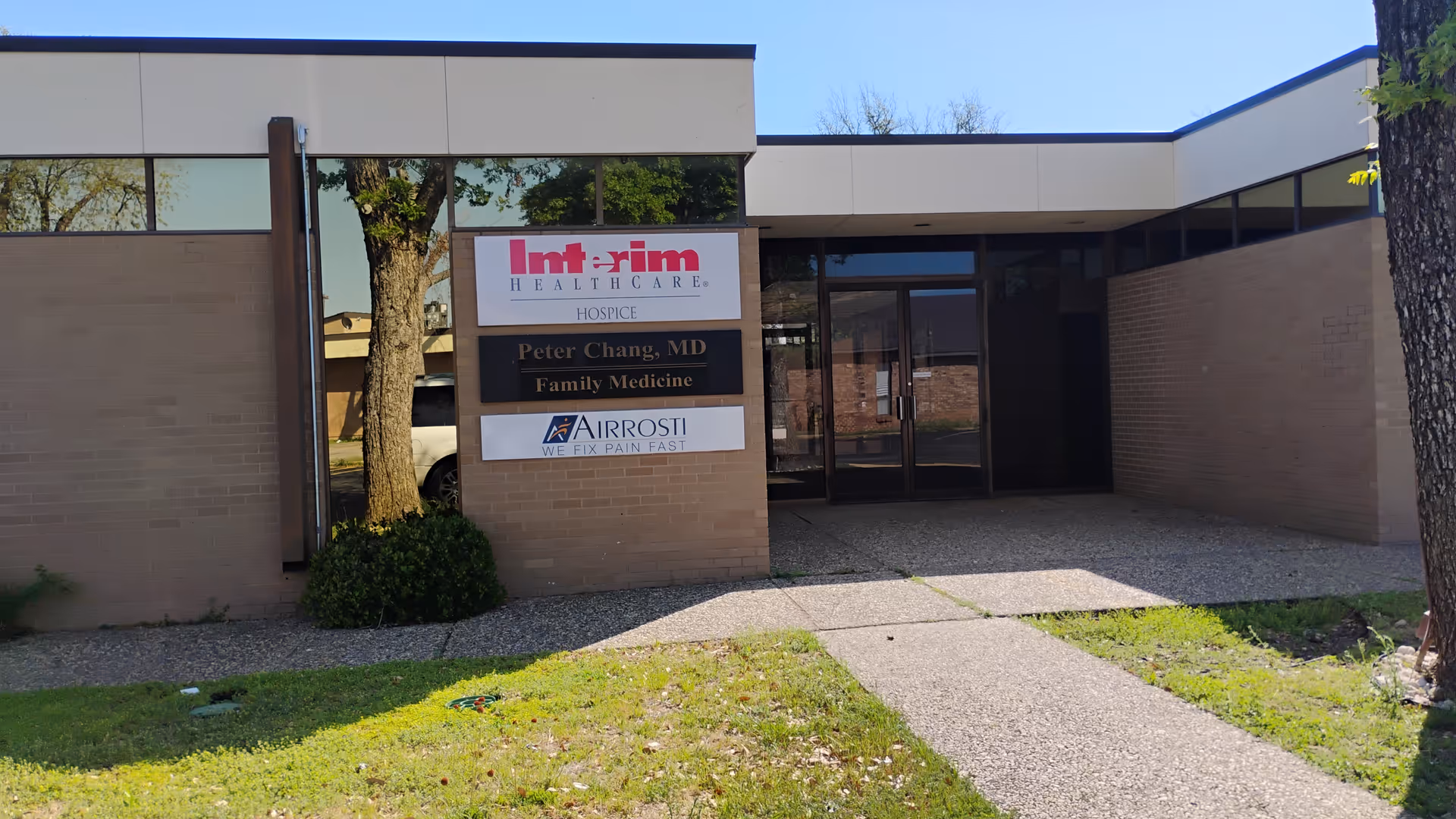 Exterior view of Interim HealthCare of San Angelo entrance with signs.