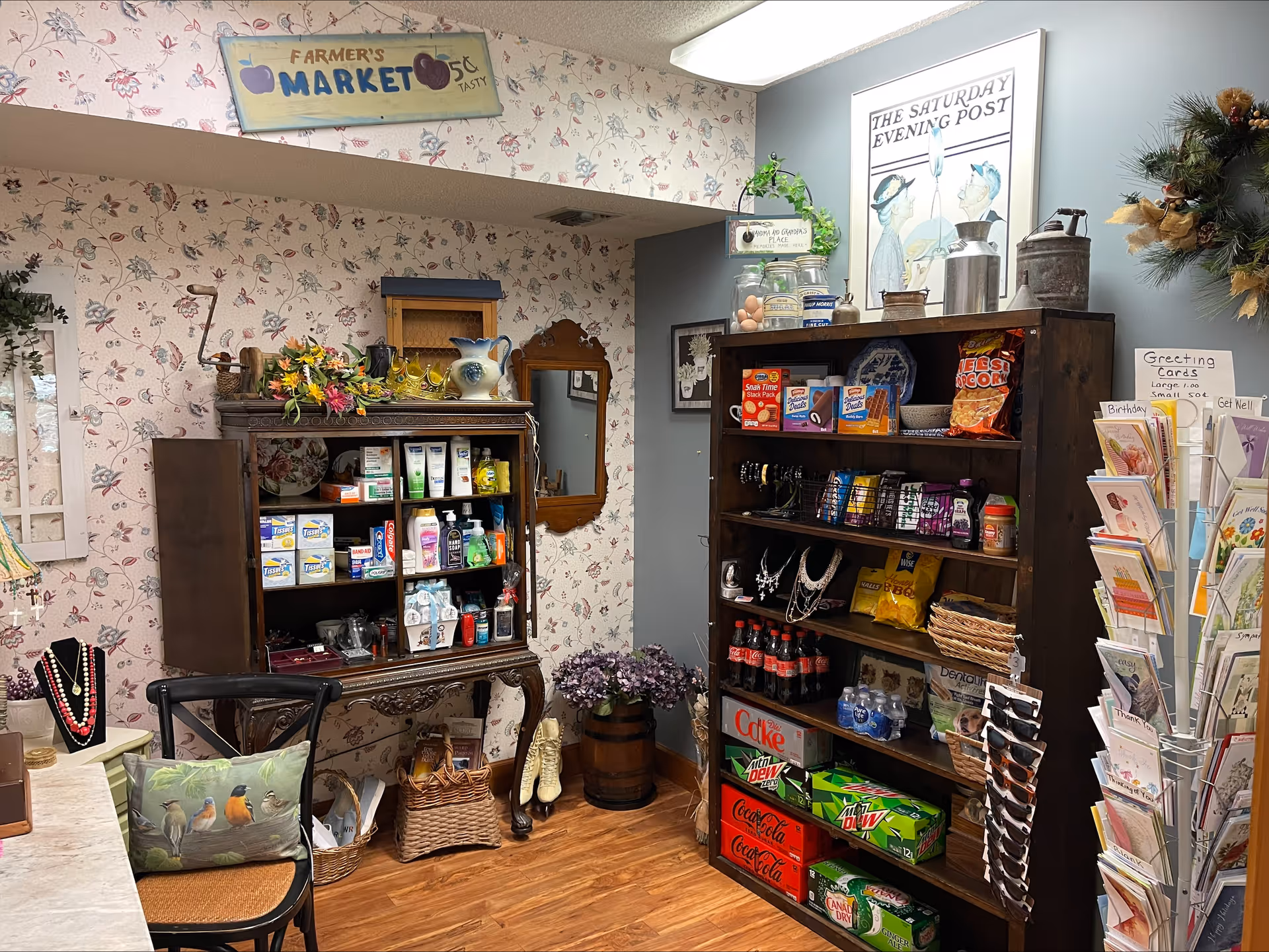 Interior shop-like common area with wooden shelves of groceries and decor.