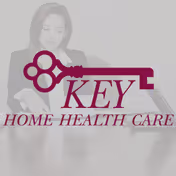 A woman sits at a desk examining papers, with a Key Home Health Care watermark overlay.