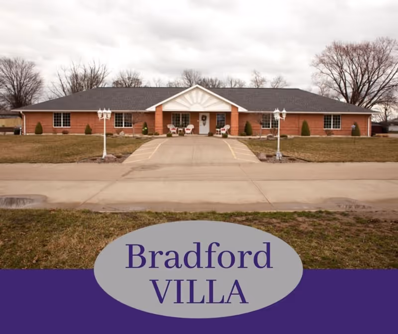 Exterior view of Bradford Villas building with brick facade and central entrance.