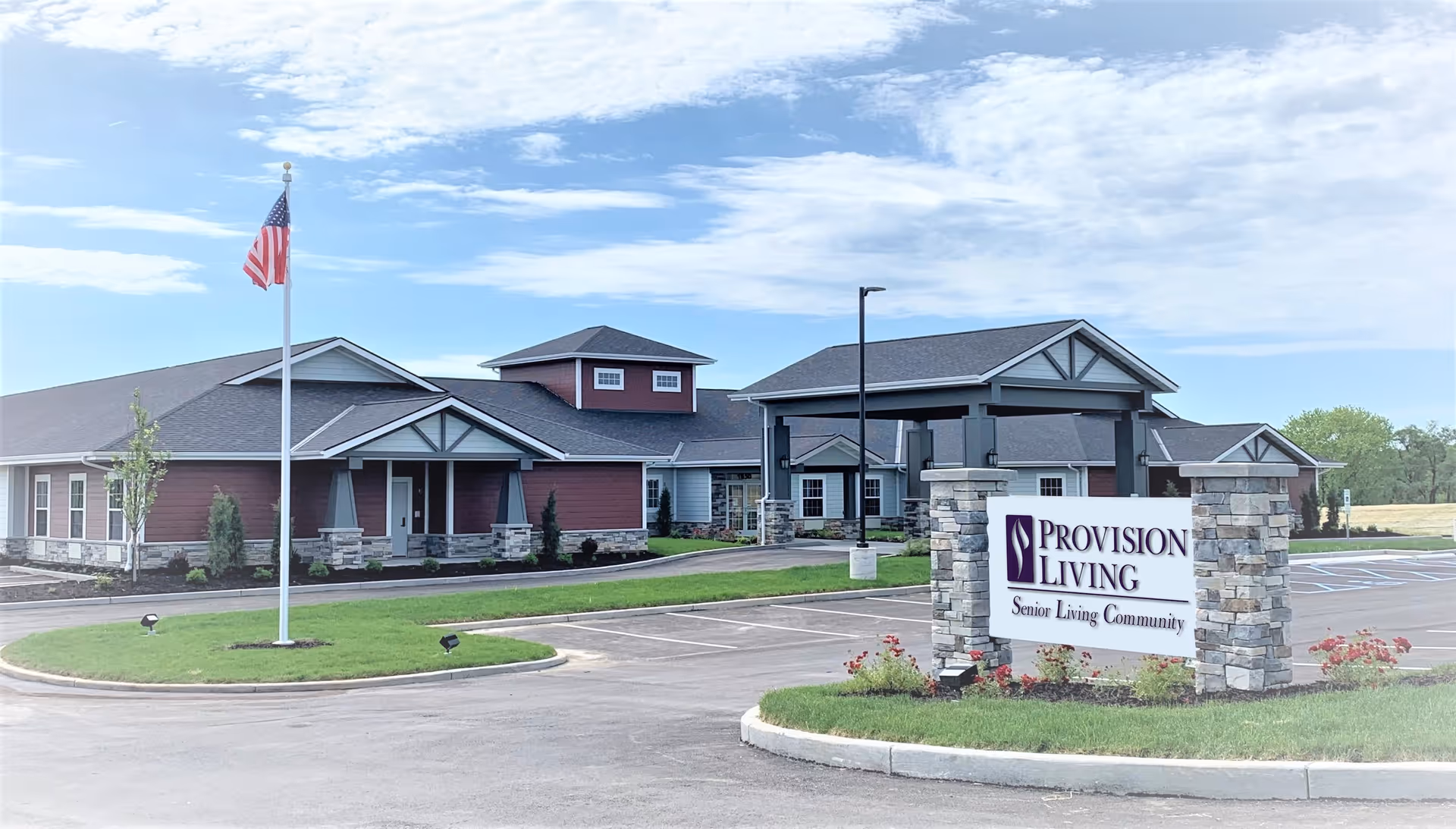 Exterior view of Provision Living at St. Joseph, showing the building entrance and sign.