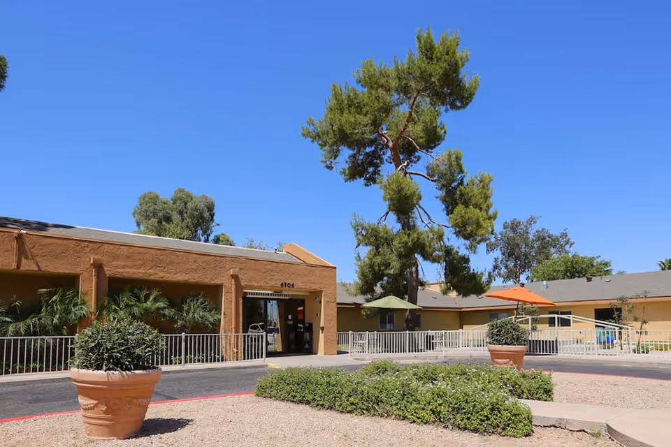 Exterior view of Horizon Post Acute and Rehabilitation Center entrance with planters and outdoor seating.