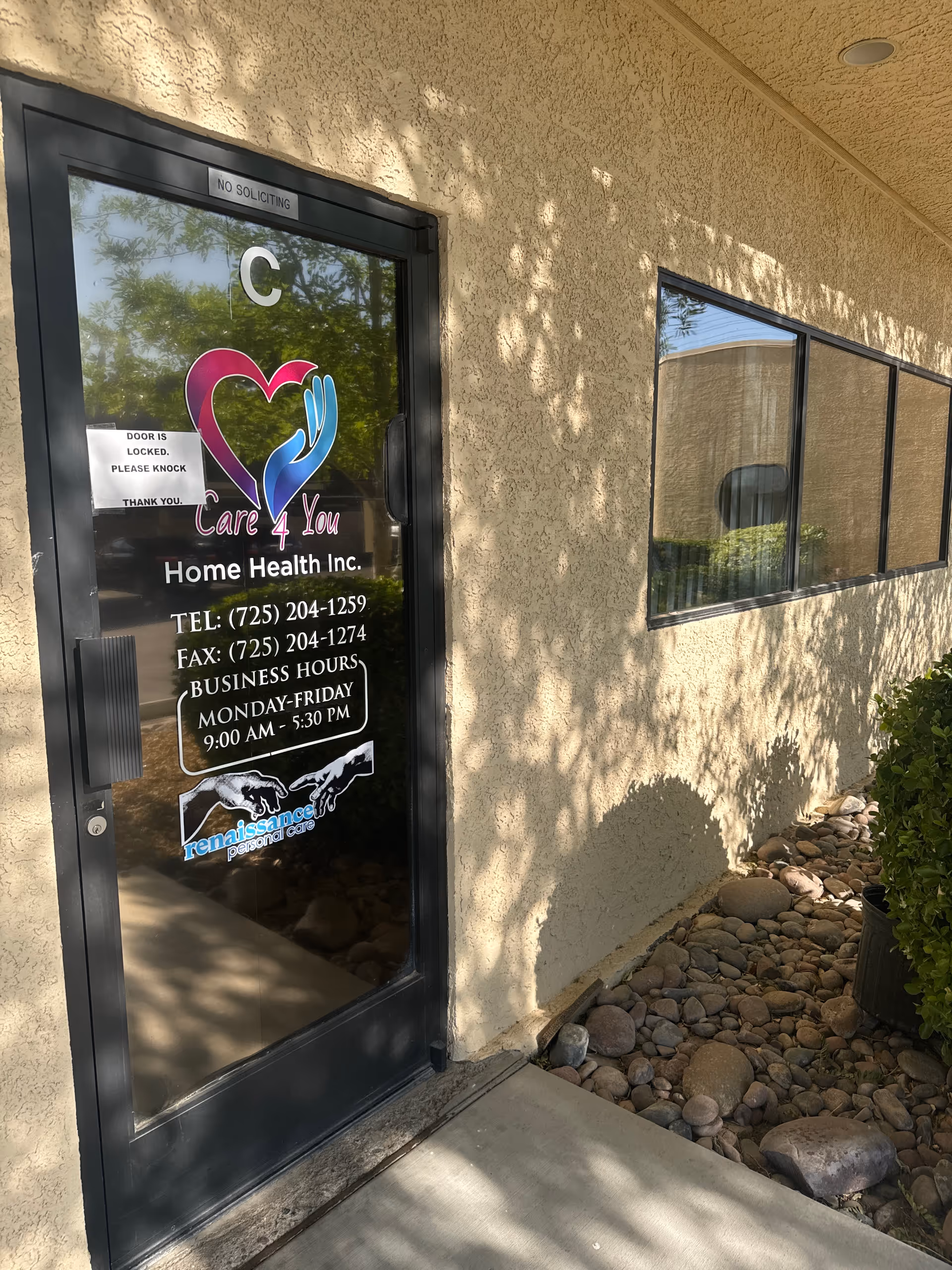 Exterior view of a Care 4 You Home Health entrance door with logo and glass windows.