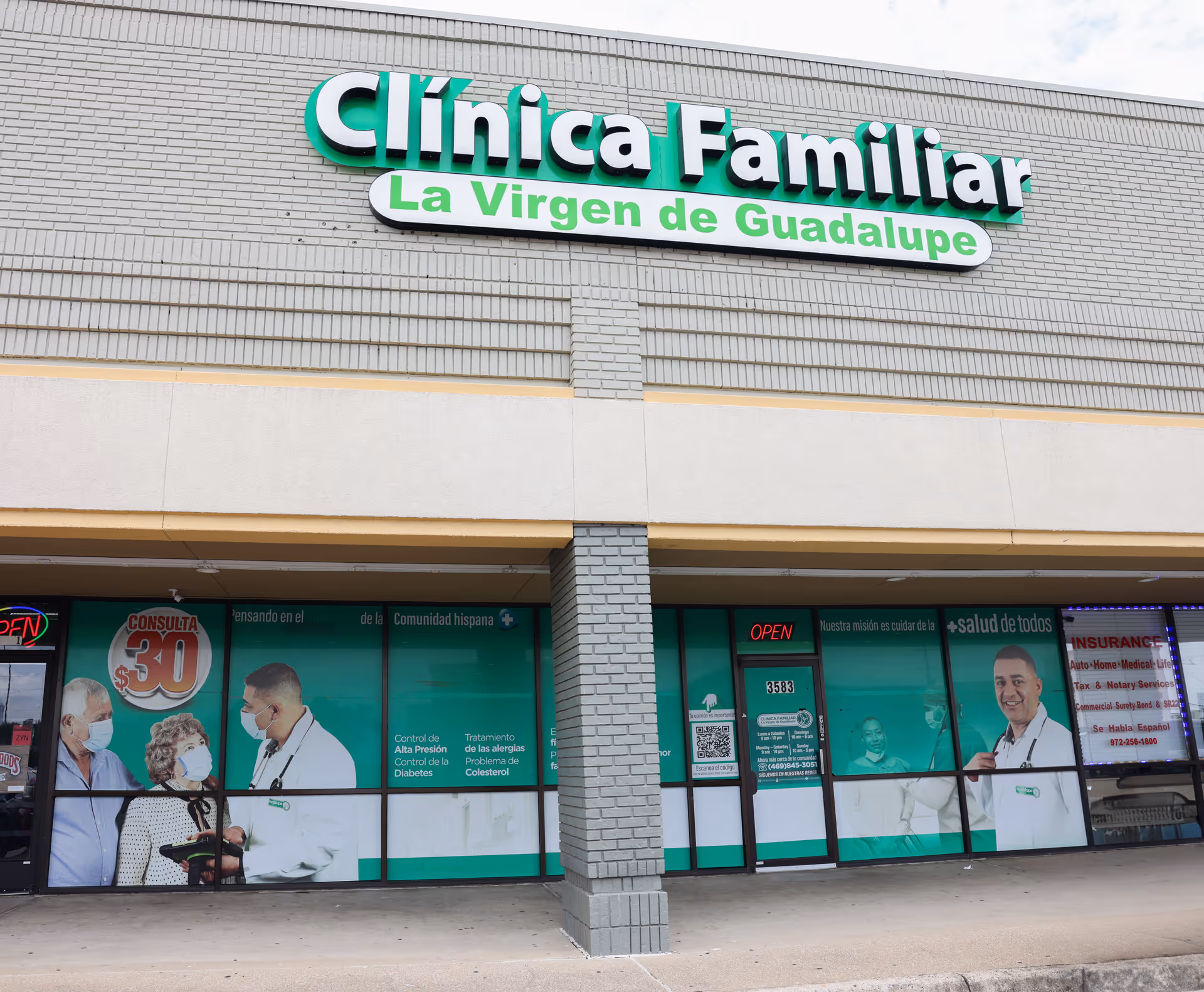 Facade of Clinica Familiar La Virgen de Guadalupe Irving with large green lettering