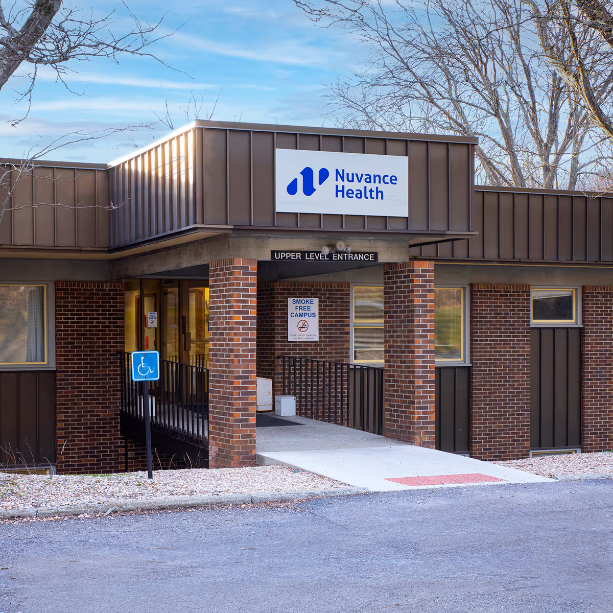 Brick building exterior with Nuvance Health sign and accessible entrance.