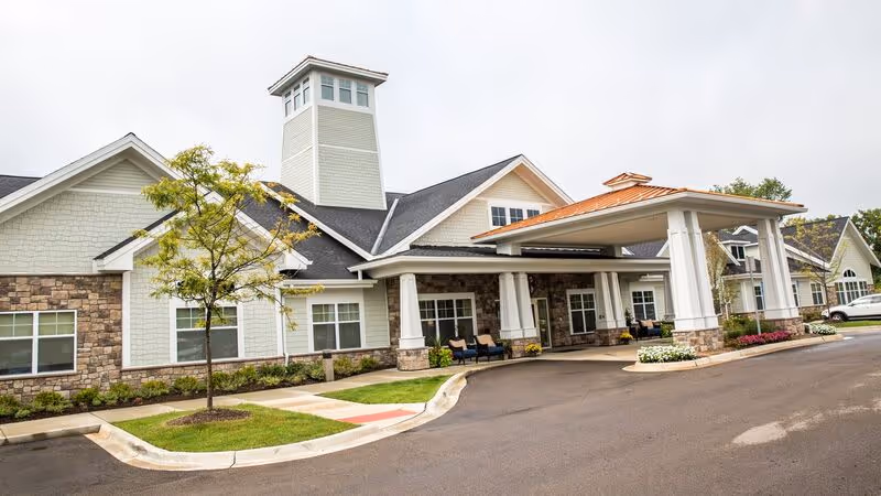 Exterior view of Beacon Square Living with a covered entrance and landscaped front.