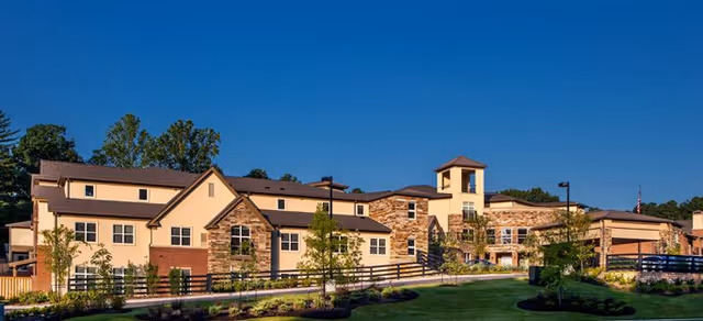 Exterior view of Brookdale Dogwood Creek building with stone accents and manicured lawn.