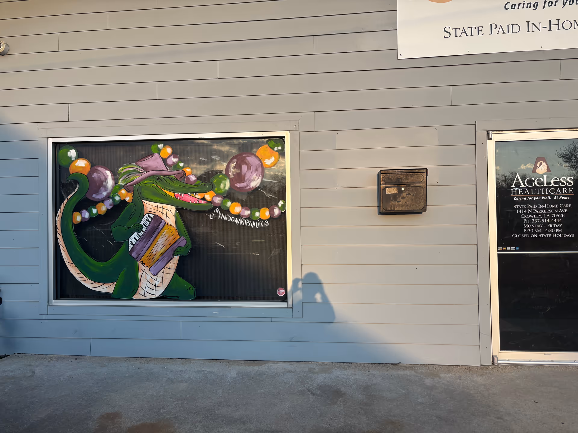Exterior wall of Ageless Healthcare building featuring a colorful mural and a doorway.
